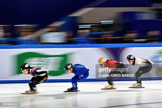 South Korea's Kim Gil-li , Italy's Arianna Fontana , China's Gong Li and Hungary's Rebeka Sziliczei-Nemet compete in the women's 1000 meter...