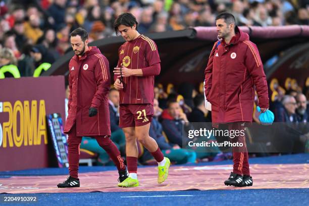 Paulo Dybala of A.S. Roma leaves the field injured during the 29th day of the Serie A Championship between A.S. Roma and Cagliari Calcio at the...