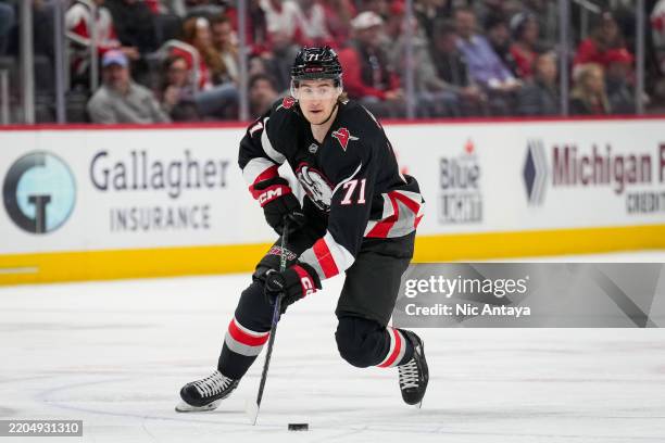 Ryan McLeod of the Buffalo Sabres skates with the puck against the Detroit Red Wings at Little Caesars Arena on March 12, 2025 in Detroit, Michigan.