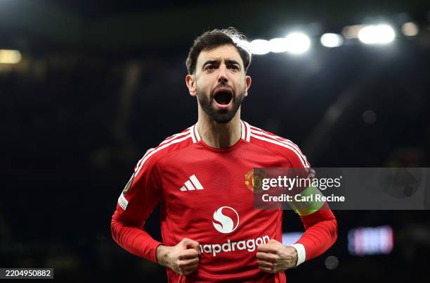 Bruno Fernandes of Manchester United celebrates scoring his team's first goal from the penalty spot during the UEFA Europa League 2024/25 Round of 16...