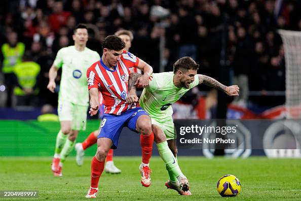 Julian Inigo Julian Alvarez of Atletico de Madrid and Inigo Martinez of Barcelona ...