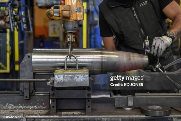Technician works on a production line for hollow-body shells at the workshop of the "Forges de Tarbes" which produces munitions for French Caesar...
