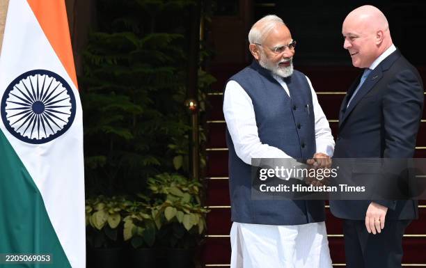 Prime Minister Narendra Modi greets New Zealand Prime Minister Christopher Luxon before their meeting at the Hyderabad House on March 17, 2025 in New...