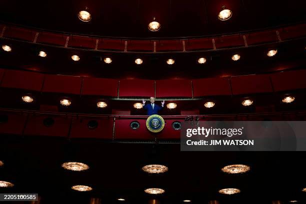President Donald Trump stands in the presidential box as he visits the John F. Kennedy Center for the Performing Arts in Washington, DC, on March 17,...