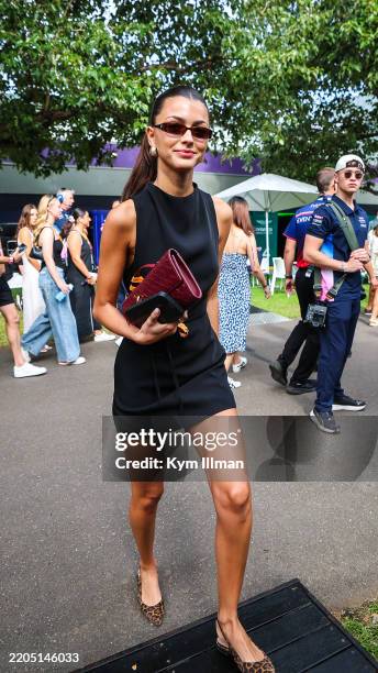 Portuguese model Francisca Gomes walks in the paddock during qualifying ahead of the F1 Grand Prix of Australia at Albert Park Grand Prix Circuit on...