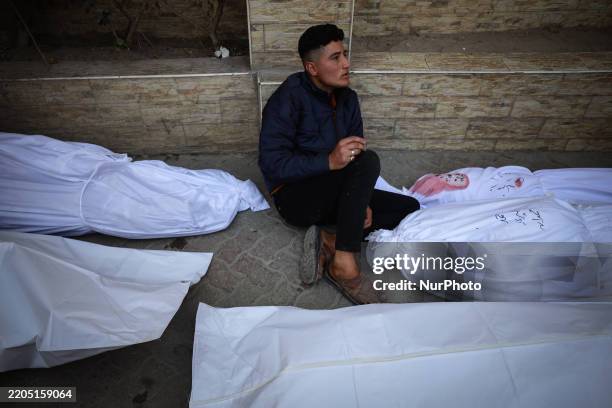 Image depicts death) People gather in the yard of the Ahli Arab hospital, also known as the Baptist hospital, to mourn and bid farewell to the bodies...