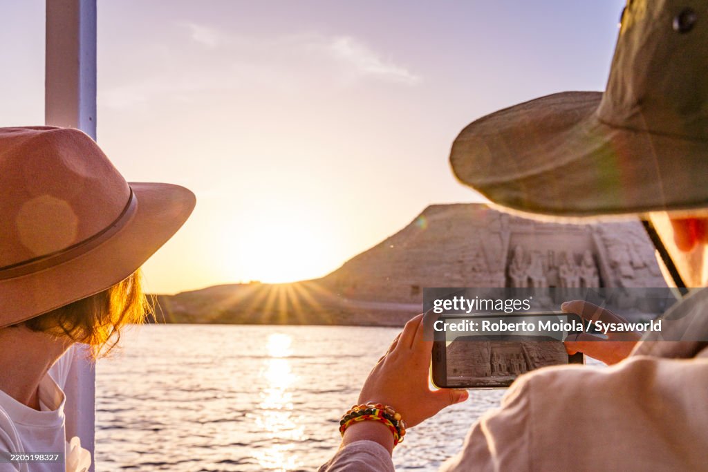 Mother and son enjoying a boat tour on Nile River