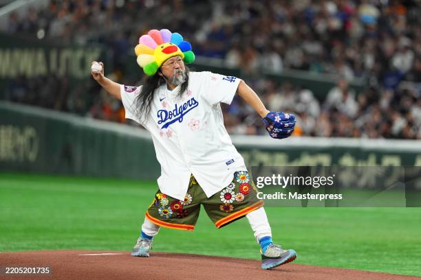 Takashi Murakami throws the ceremonial first pitch prior to the game between Los Angeles Dodgers and Yomiuri Giants at Tokyo Dome on March 15, 2025...