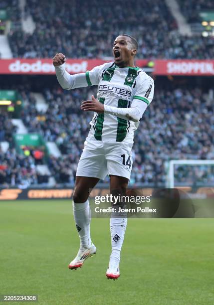 Alassane Plea of Borussia Moenchengladbach celebrates scoring his team's second goal during the Bundesliga match between SV Werder Bremen and...