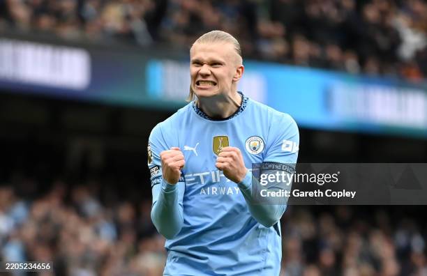 Erling Haaland of Manchester City celebrates after scoring his team's first goal from the penalty spot during the Premier League match between...