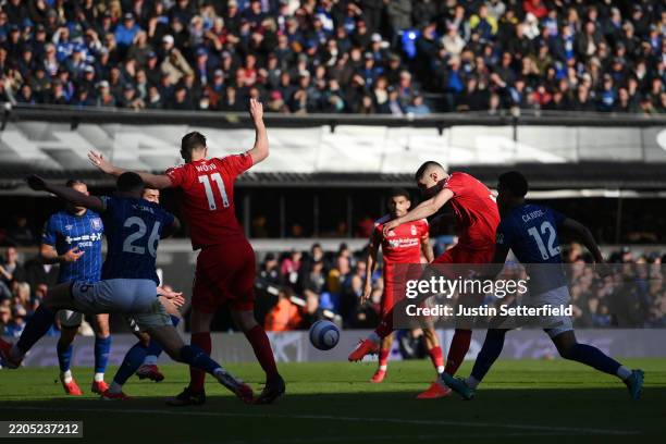 Nikola Milenkovic of Nottingham Forest scores his team's first goal under pressure from Jens Cajuste of Ipswich Town during the Premier League match...