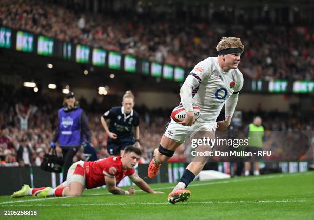 Henry Pollock of England goes over to score his team's seventh try during the Guinness Six Nations 2025 match between Wales and England at...