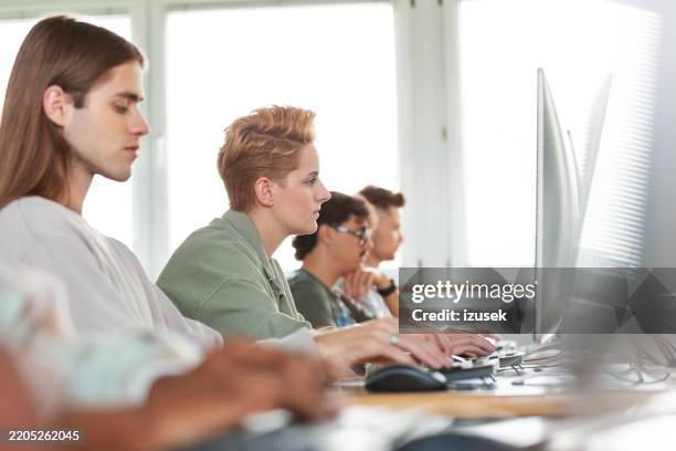 university students using computers in computer lab - hands keyboard code stock pictures, royalty-free photos & images