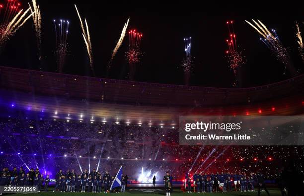 General view of the inside of the stadium as players of Scotland and France line up during the National Anthems, as a pyrotechnics display takes...