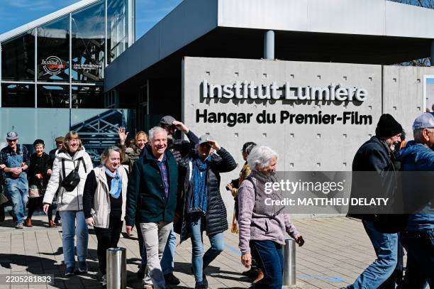 Numerous extras take part in a film re enacting the Lumiere brothers film WORKERS LEAVING THE FACTORY during the filming of THE NEW WORKERS LEAVING...