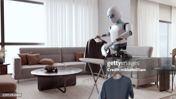 ai-powered humanoid robot doing household chores - robot bildbanksfoton och bilder
