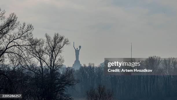 majestic mother ukraine monument rises against the skyline of kyiv, reflecting a spirit of resilience and unity - famous landmarks in ukraine stock pictures, royalty-free photos & images