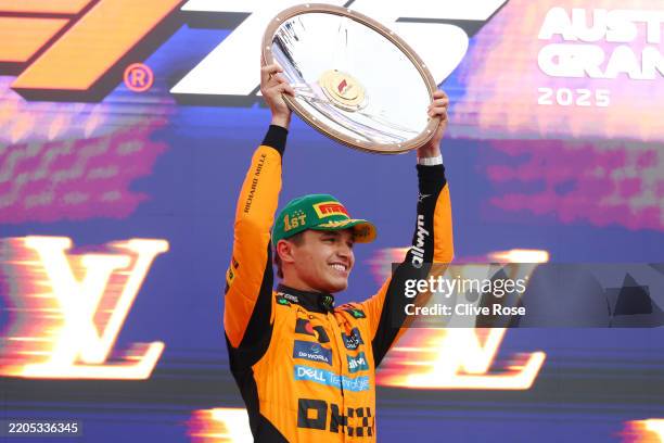 Race winner Lando Norris of Great Britain and McLaren on the podium during the F1 Grand Prix of Australia at Albert Park Grand Prix Circuit on March...