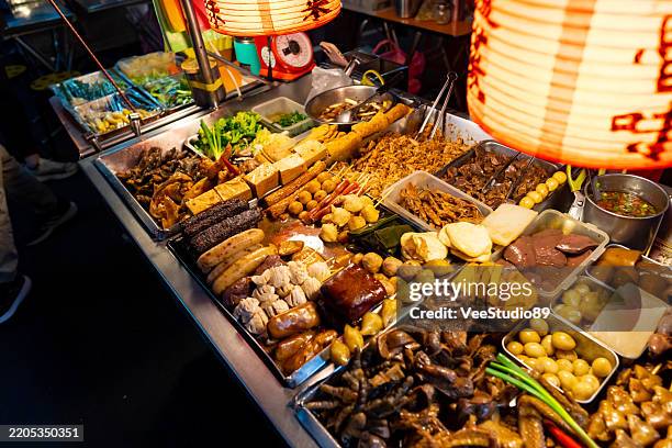 street food at night market in taipei, taiwan. - taipei stock pictures, royalty-free photos & images