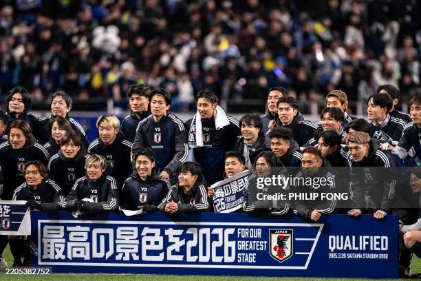 Team Japan celebrates after winning the 2026 FIFA World Cup Asian qualification football match between Japan and Bahrain in Saitama on March 20, 2025.