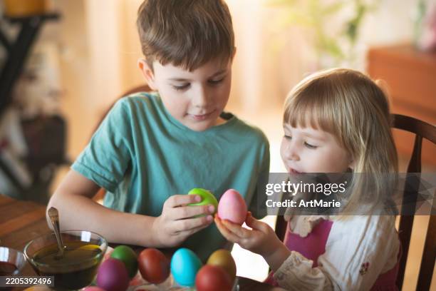 children painting easter eggs - kids spring drawing stock pictures, royalty-free photos & images