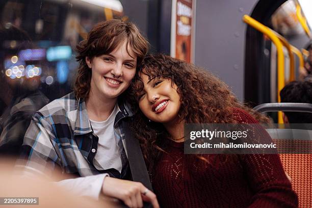 teenagers in public transport - girl flirting stock pictures, royalty-free photos & images