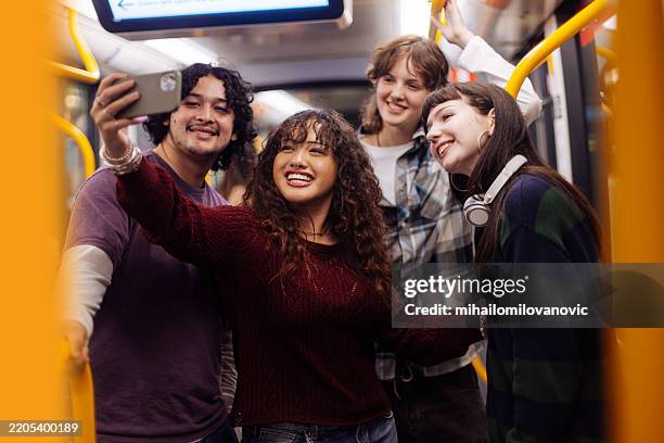 diverse teenagers taking selfies in subway train - generation alpha stock pictures, royalty-free photos & images