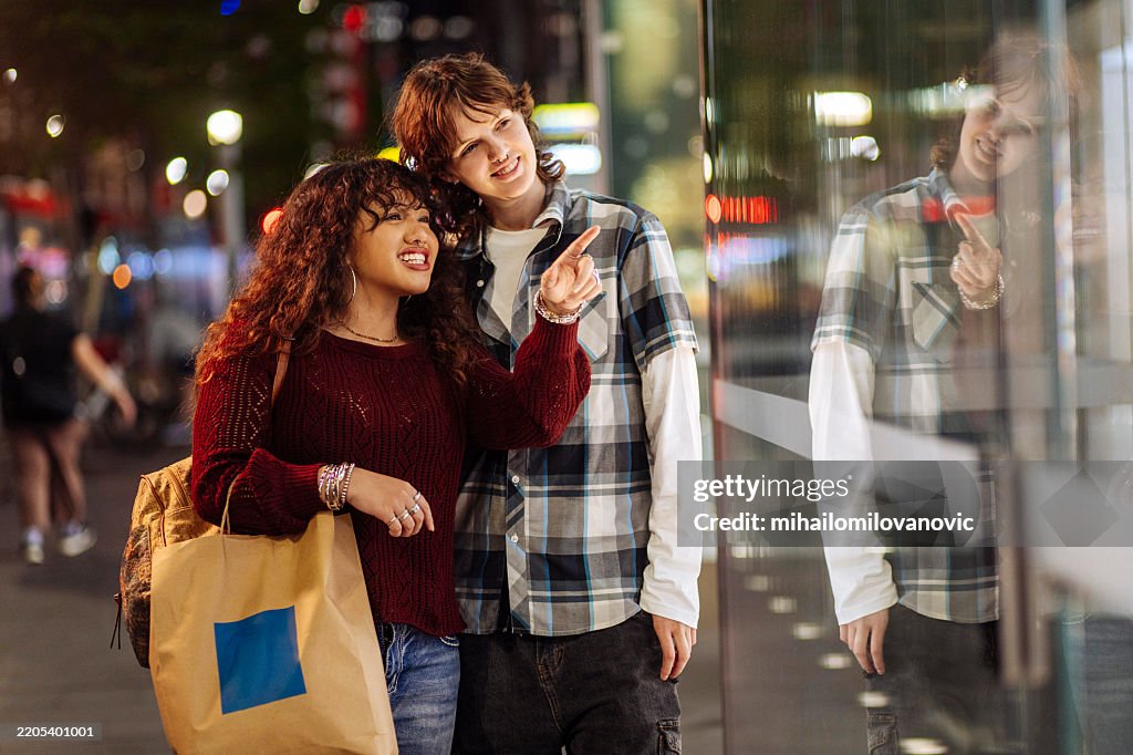 Teenage couple on a city street