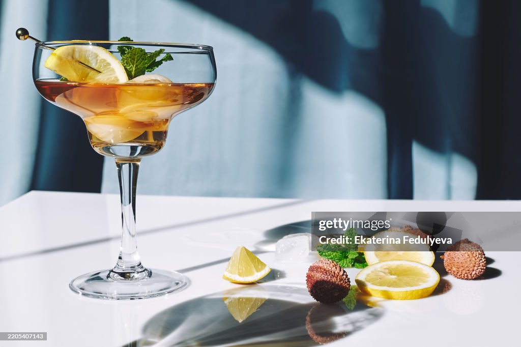 Refreshing lychee drink with lime, mint leaves and ice.