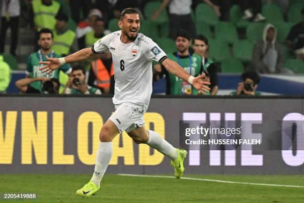 Iraq's defender Akam Hashim celebrates scoring his team's first goal during the FIFA World Cup 2026 Asia zone qualifiers group B football match...