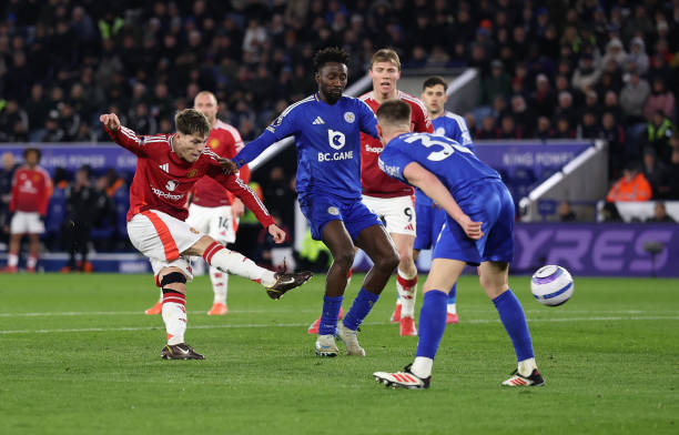 Alejandro Garnacho of Manchester United scores his team's second goal under pressure from Wilfred Ndidi and Luke Thomas of Leicester City during the...