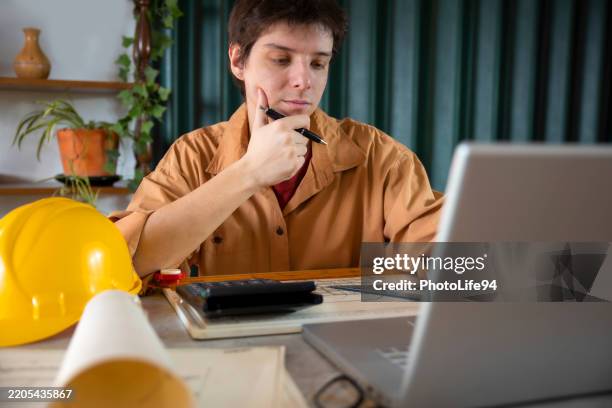 student of architecture working at his desk - real estate developer stock pictures, royalty-free photos & images