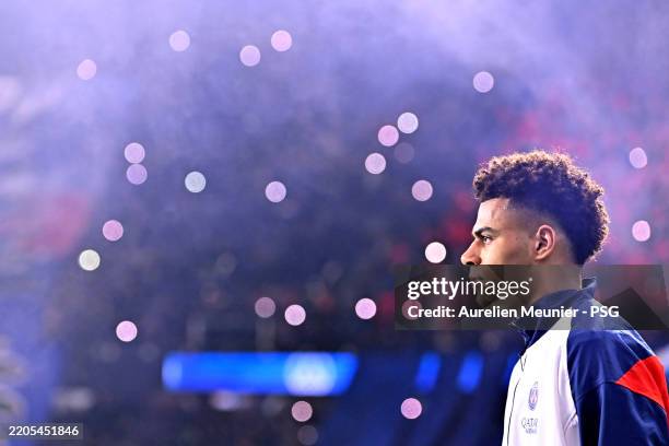 Desire Doue of Paris Saint-Germain walks on the pitch before the Ligue 1 match between Paris Saint-Germain and Olympique de Marseille at Parc Des...