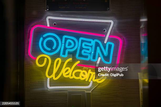 led "open welcome" sign - led lights signage stock pictures, royalty-free photos & images