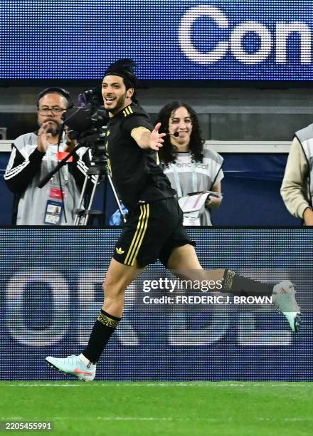 Mexico's forward Raul Jimenez celebrates scoring his team's first goal during the CONCACAF Nations League semifinal football match between Canada and...