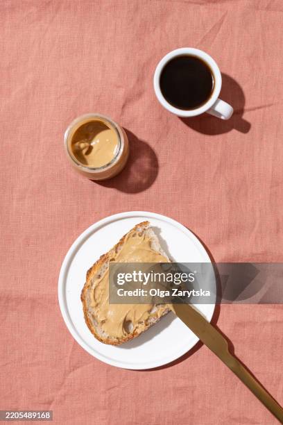 peanut butter toast and cup of coffee. - peanut butter stock pictures, royalty-free photos & images
