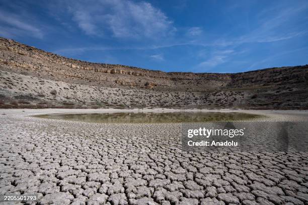 View from Meke Lake, a volcanic crater lake referred to as the "evil eye of the world", while the number of sinkholes, which are formed when...