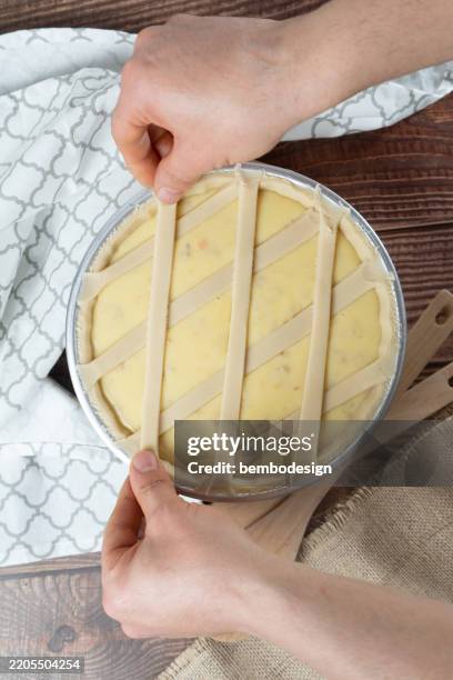 preparation of neapolitan pastiera cake with ricotta - shortcrust pastry stock pictures, royalty-free photos & images