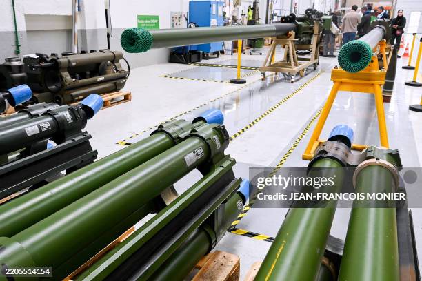 This photograph shows recoiling masses and Caesar cannons displayed at an assembly line during a visit at the site of the French-German KNDS armament...