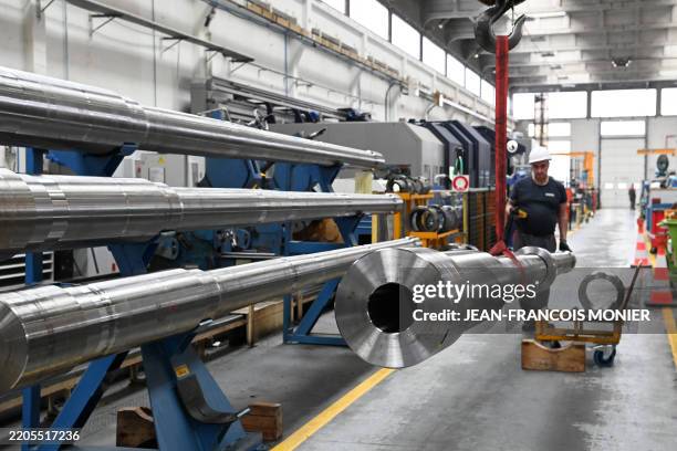 An employee assembles a Caesar cannon at the site of the French-German KNDS armament factory in Bourges, center France on March 21, 2025.