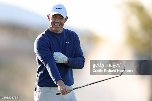 Rory McIlroy of Northern Ireland looks on while warming up on the practice range prior to the playoff during the final round of THE PLAYERS...
