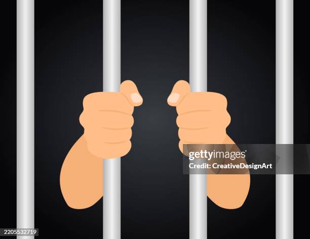 close-up of hands holding prison bars from inside the cell - prison bars stock illustrations