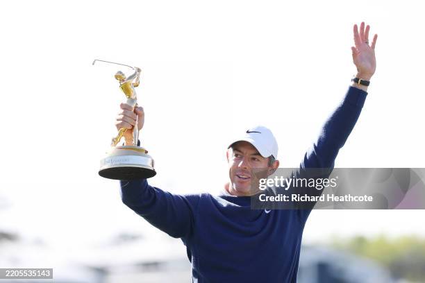 Rory McIlroy of Northern Ireland celebrates with the trophy after winning the playoff in the final round of THE PLAYERS Championship on the Stadium...