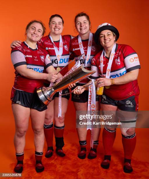 Neve Jones, Kate Williams, Bethan Lewis and Kathryn Buggy of Gloucester-Hartpury pose for a portrait with the Premiership Women's Rugby Trophy after...