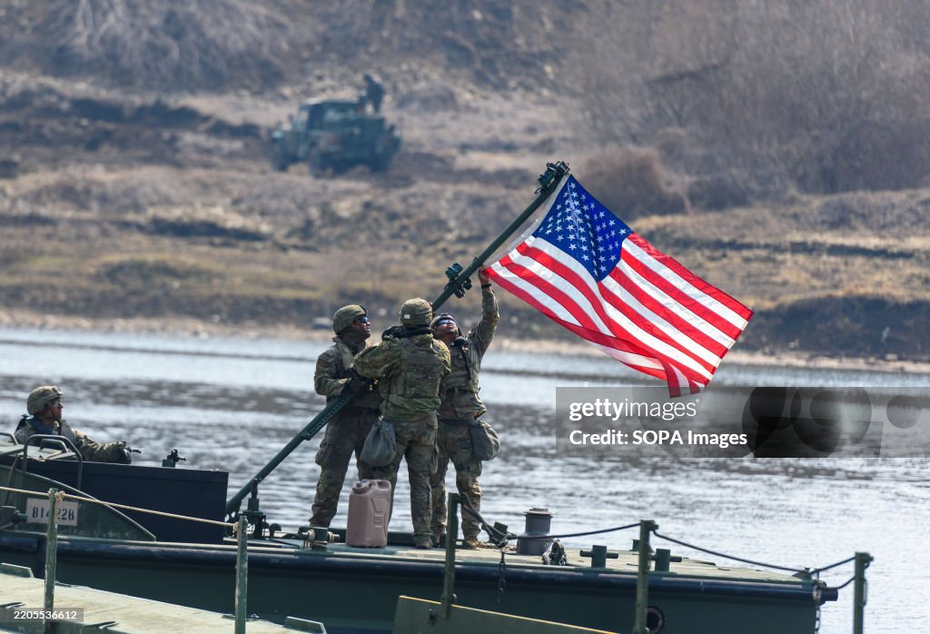 U.S. Army soldiers are installing the U.S. flag during a