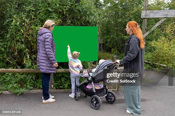 child points at a chroma key board - northumberland map stock pictures, royalty-free photos & images