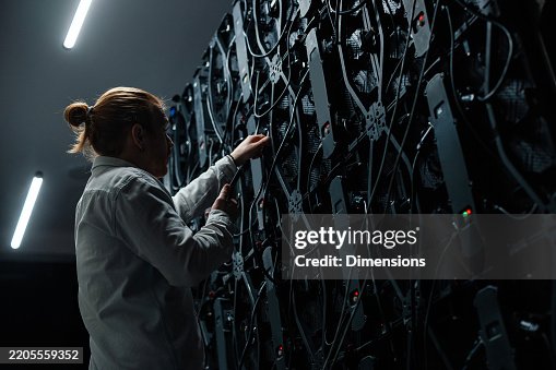 Technician adjusting cables on large led screen panel Technician adjusting cables on large led screen panel