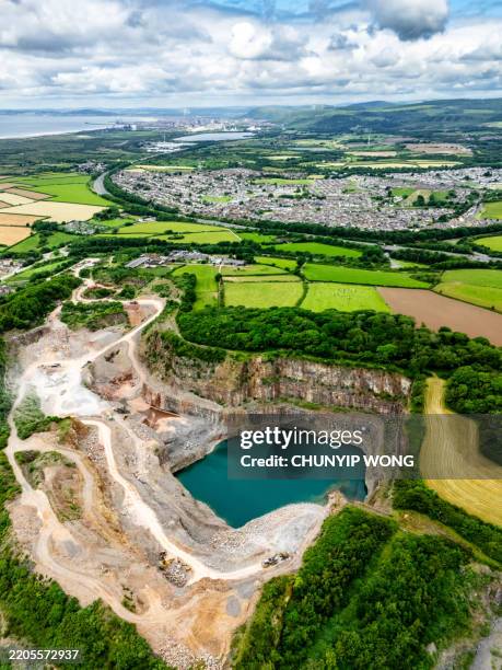 drone view of cornelly quarry in wales, uk - escarpment stock pictures, royalty-free photos & images