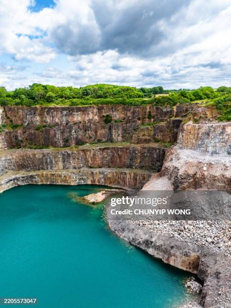 drone view of cornelly quarry in wales, uk - escarpment stock pictures, royalty-free photos & images