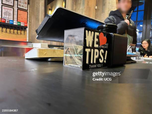 We appreciate Tips, Thank you, tips jar in Mighty Quinns BBQ restaurant, Queens, New York.